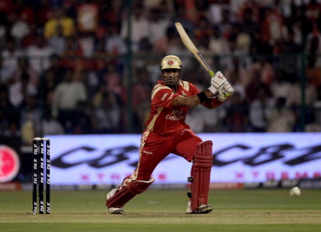 Dravid, and Uthappa scored half-centuries in contrasting styles to ace the chase