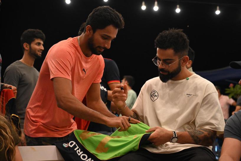 Mohammed Azharuddeen took to social media to post a picture of Virat Kohli autographing a jersey for him. Mohammed Azharuddeen took to social media to post a picture of Virat Kohli autographing a jersey for him.